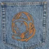 Faded arch logo denim pants